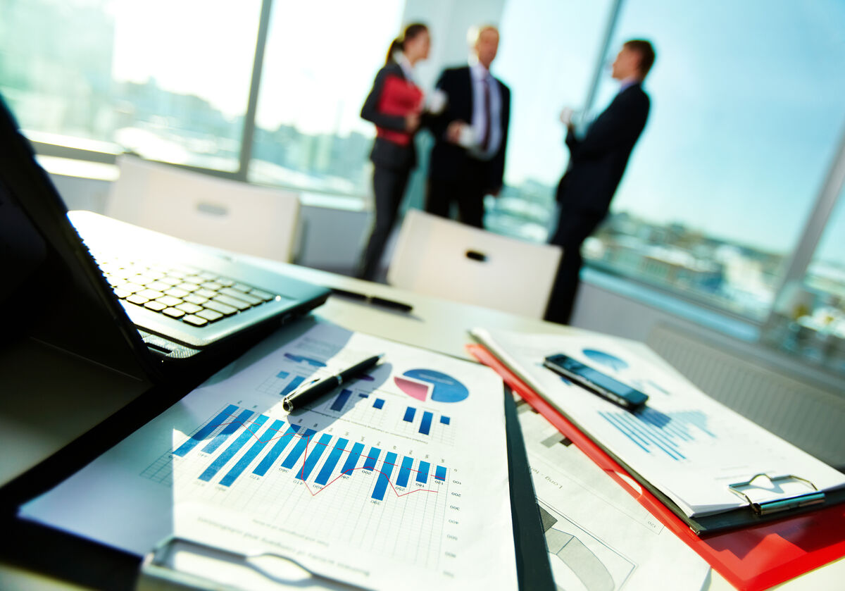 Team reviewing cloud performance reports in a modern office
